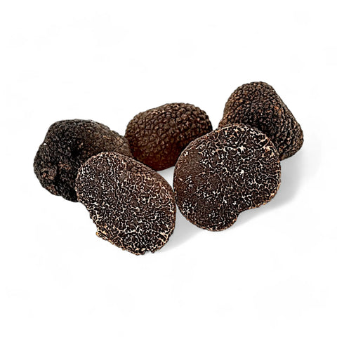 Black truffle chocolate bonbons with textured surface from Fresh Tuber Melanosporum Black Diamond Truffles