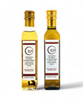 Two bottles of Black and White Truffle Olive Oil with white truffle aroma